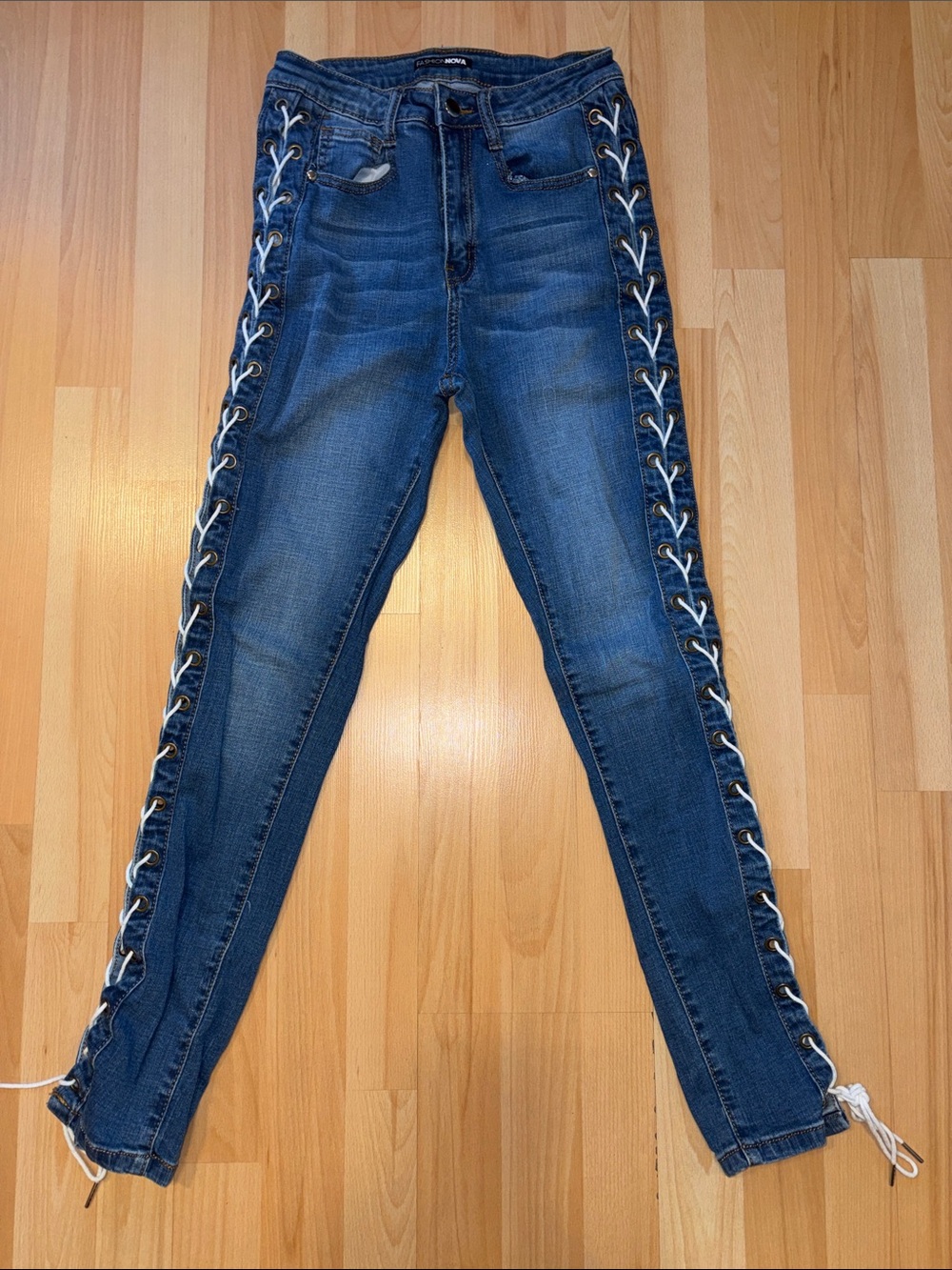 Fashion Nova Dark Blue Skinny Jeans with White Lace-Up Sides